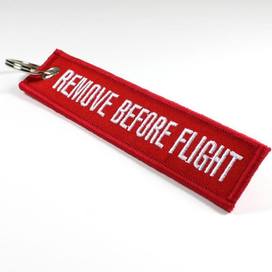 Remove Before Flight key ring - red